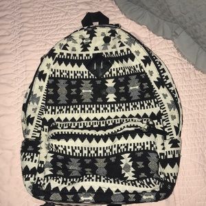 Black and cream patterned backpack